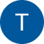 White capital letter T inside a solid blue circle against a black background